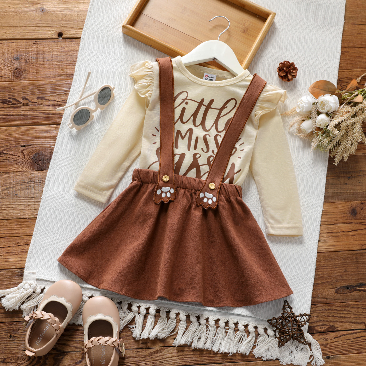 

2-piece Toddler Girl Letter Print Ruffled Long-sleeve Top and Dog Footprint Brown Suspender Skirt Set
